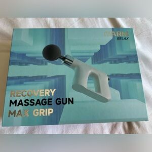 NIB Massage Gun with rechargeable battery and multiple accessories heads